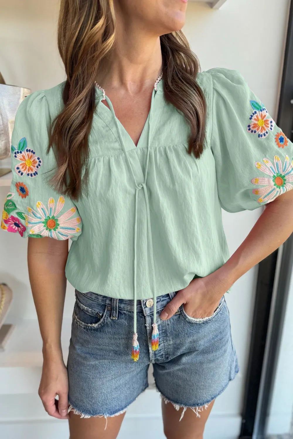 Embroidered Tie Neck Short Sleeve Blouse.