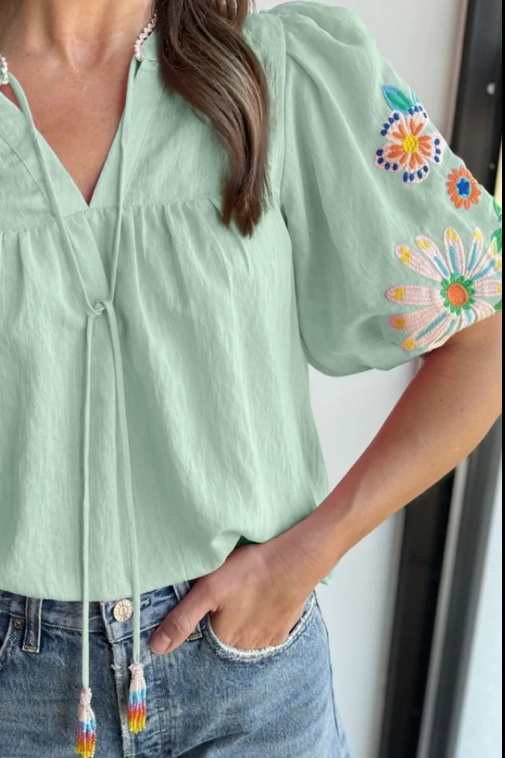 Embroidered Tie Neck Short Sleeve Blouse.