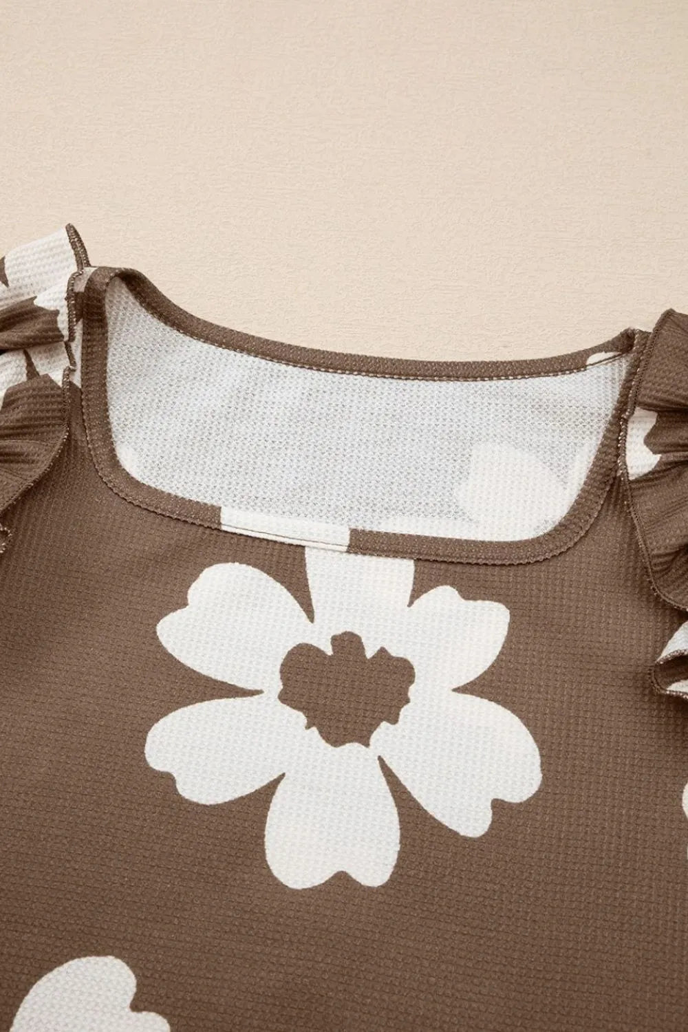 Floral Textured Ruffled Cap Sleeve Blouse.