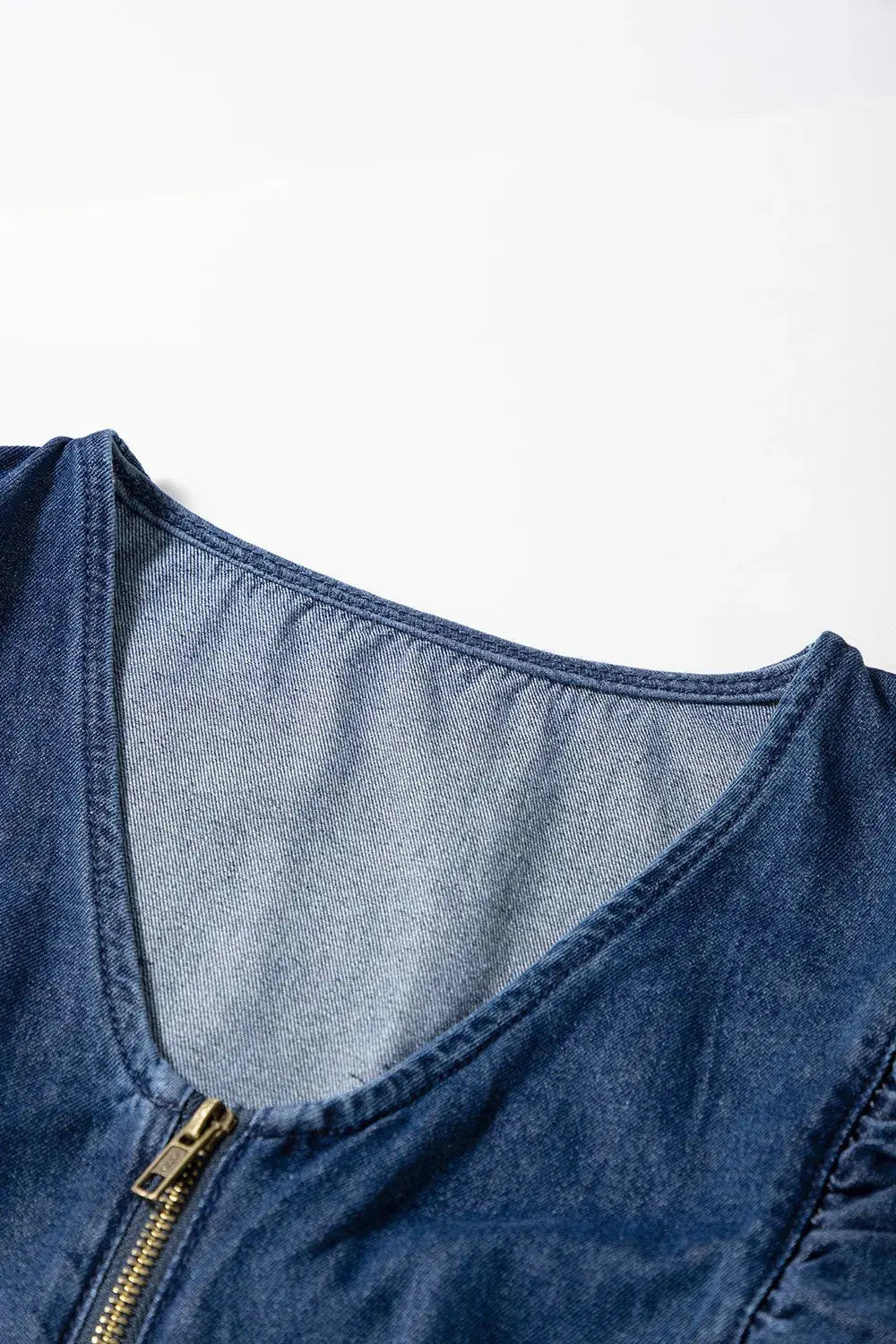 Denim Ruffled Zipped Front Belted Romper.