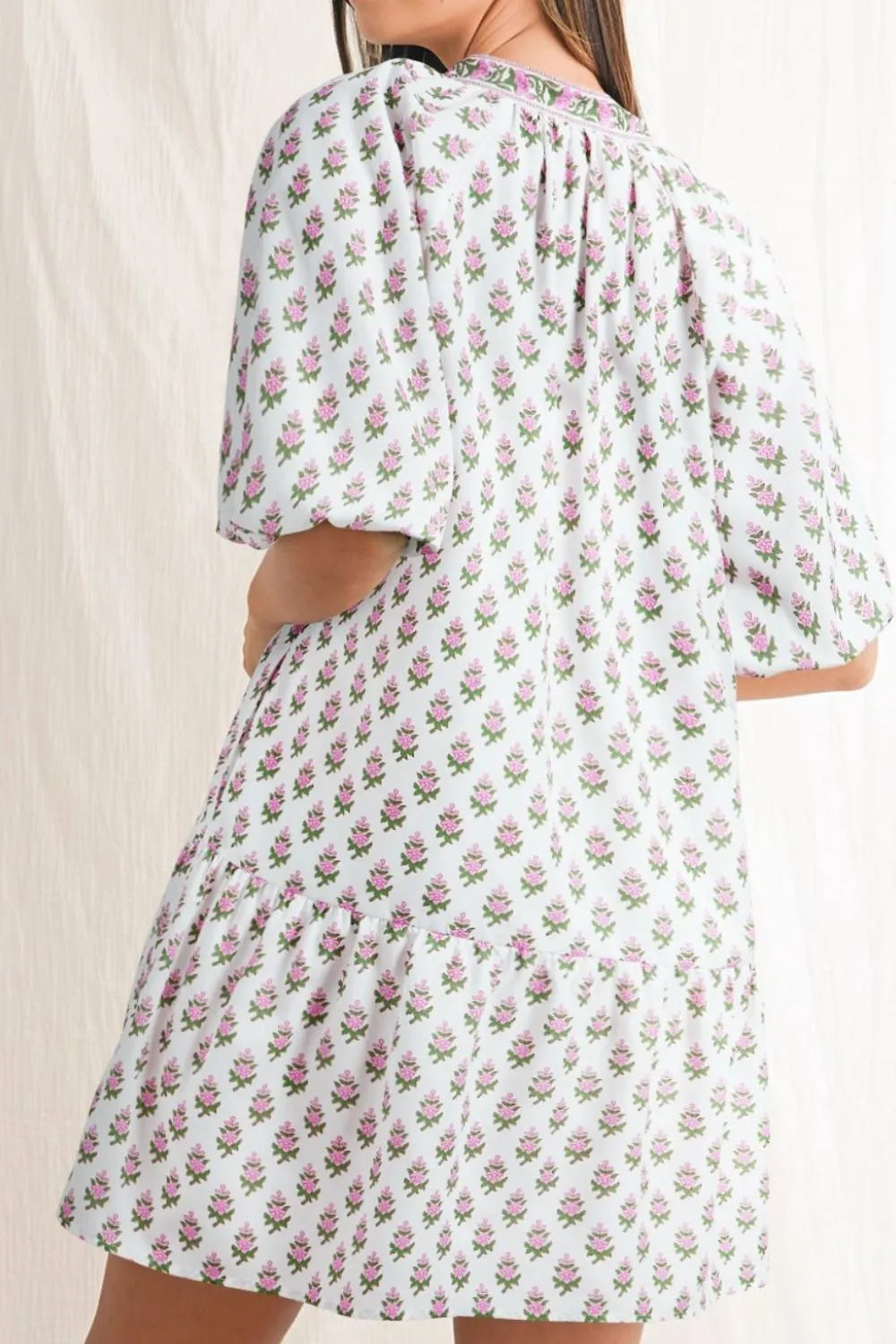 Puff Sleeve Tie Neck Ruffled Hem Dress.