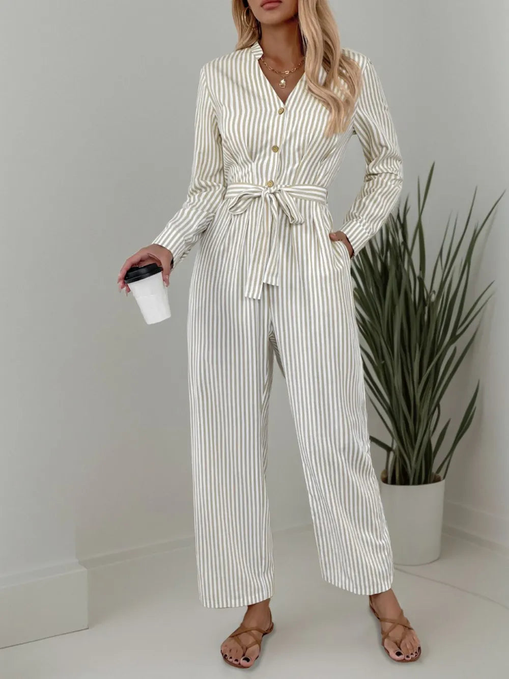 Striped Notched Long Sleeve Tie Waist Jumpsuit.