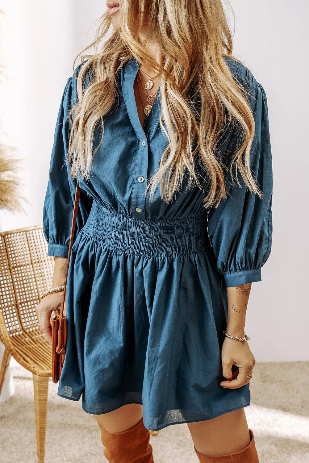 Smocked Half Button Three-Quarter Sleeve Mini Dress.