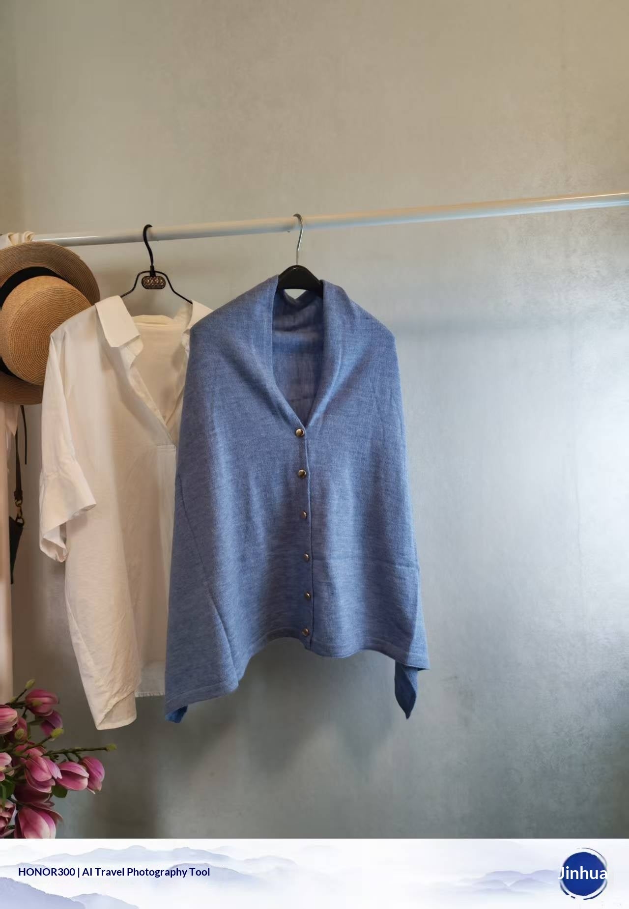 Light blue slouchy knit shawl with button front for women. Soft blended fabric offering warm, sophisticated autumn style.