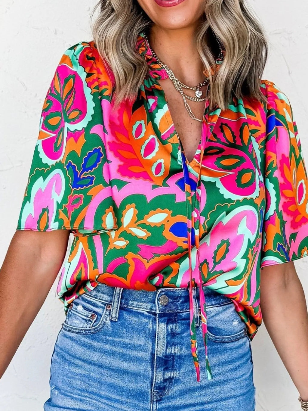 Tropical Print Short Sleeve Tie Neck Blouse.