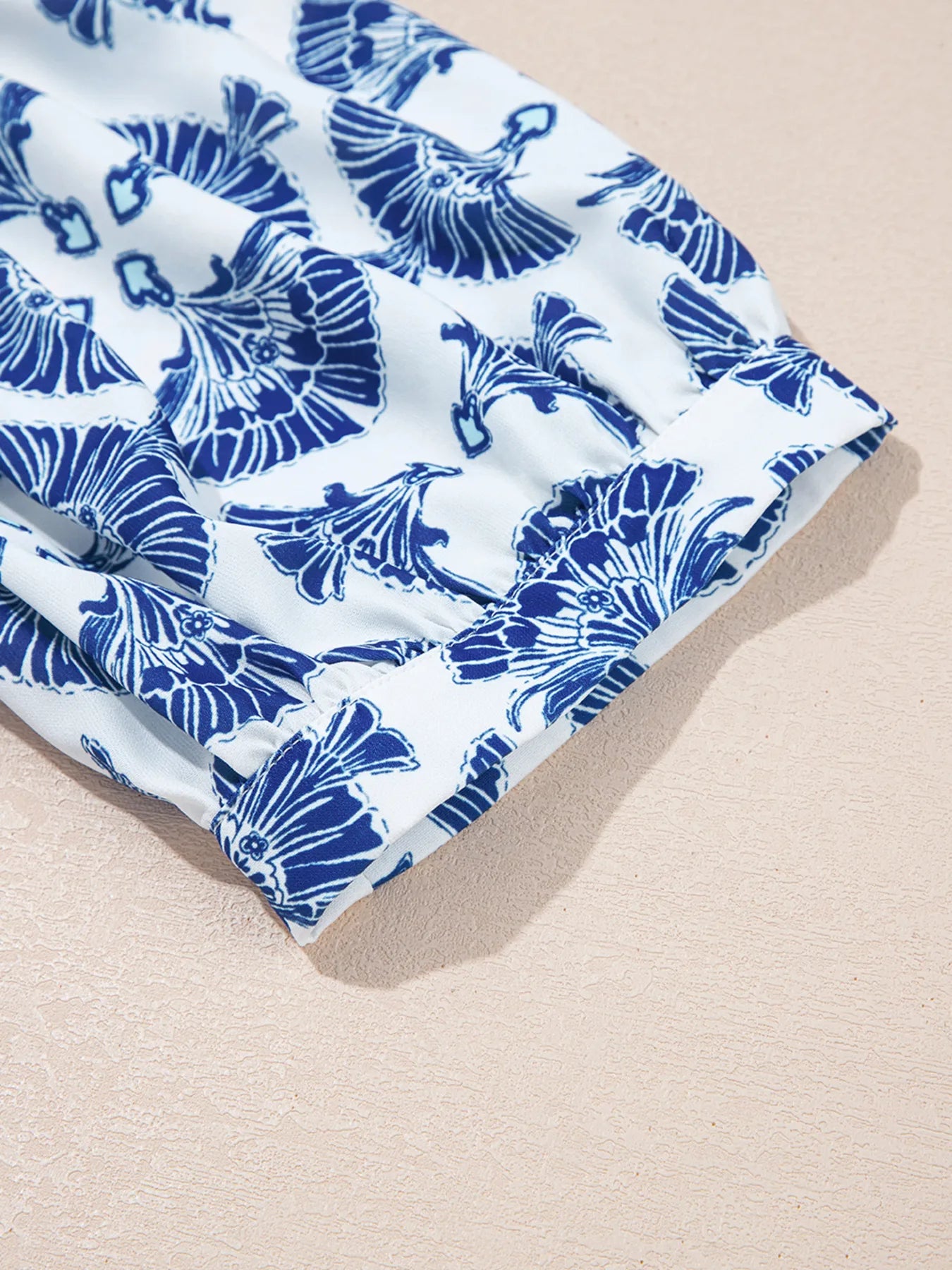 Printed Tassel Tie Neck Blouse.