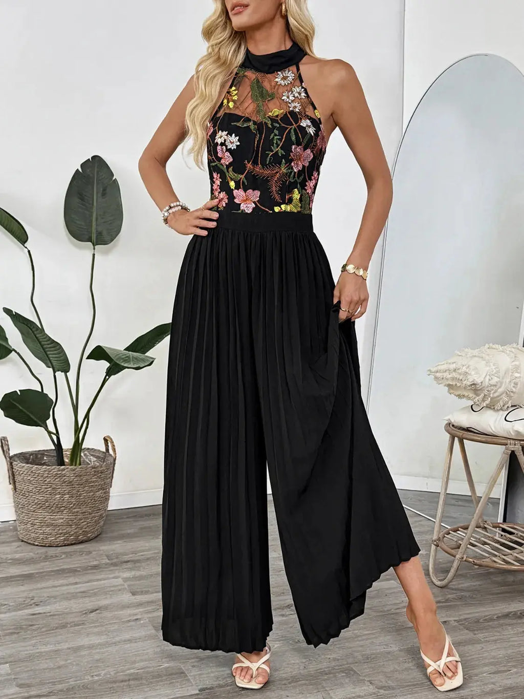 Floral Embroidered Halter Neck Pleated Jumpsuit.