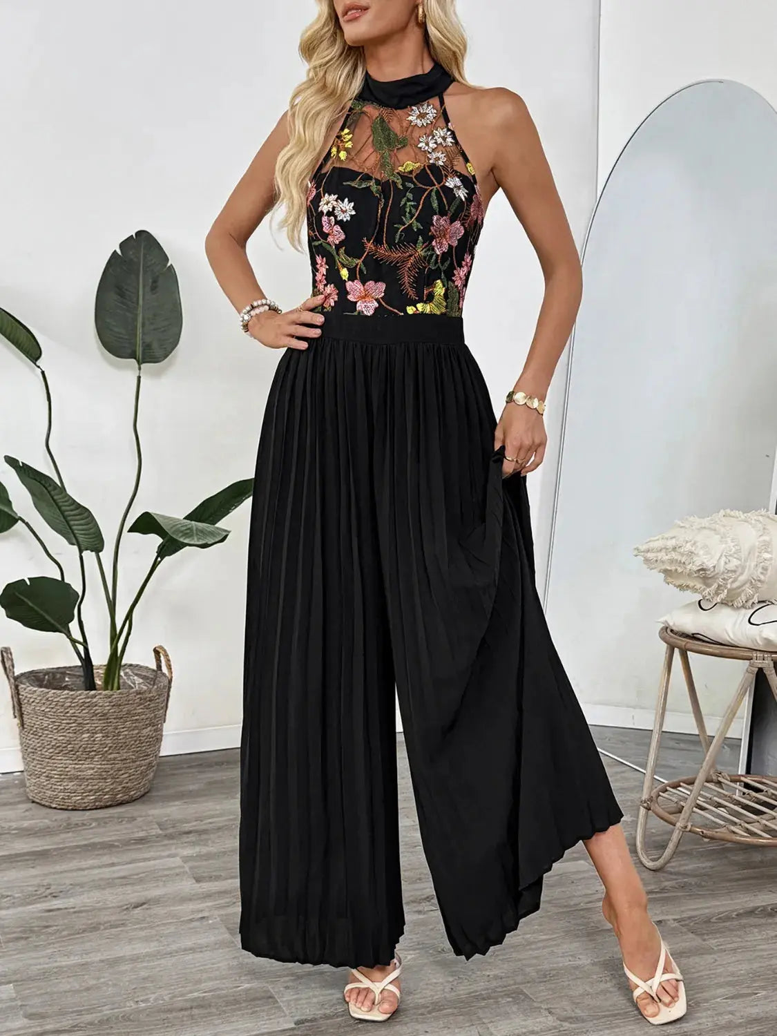Floral Embroidered Halter Neck Pleated Jumpsuit.