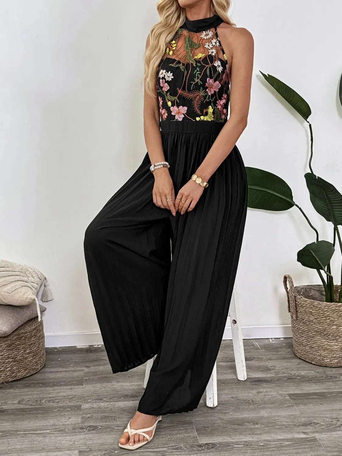 Floral Embroidered Halter Neck Pleated Jumpsuit.