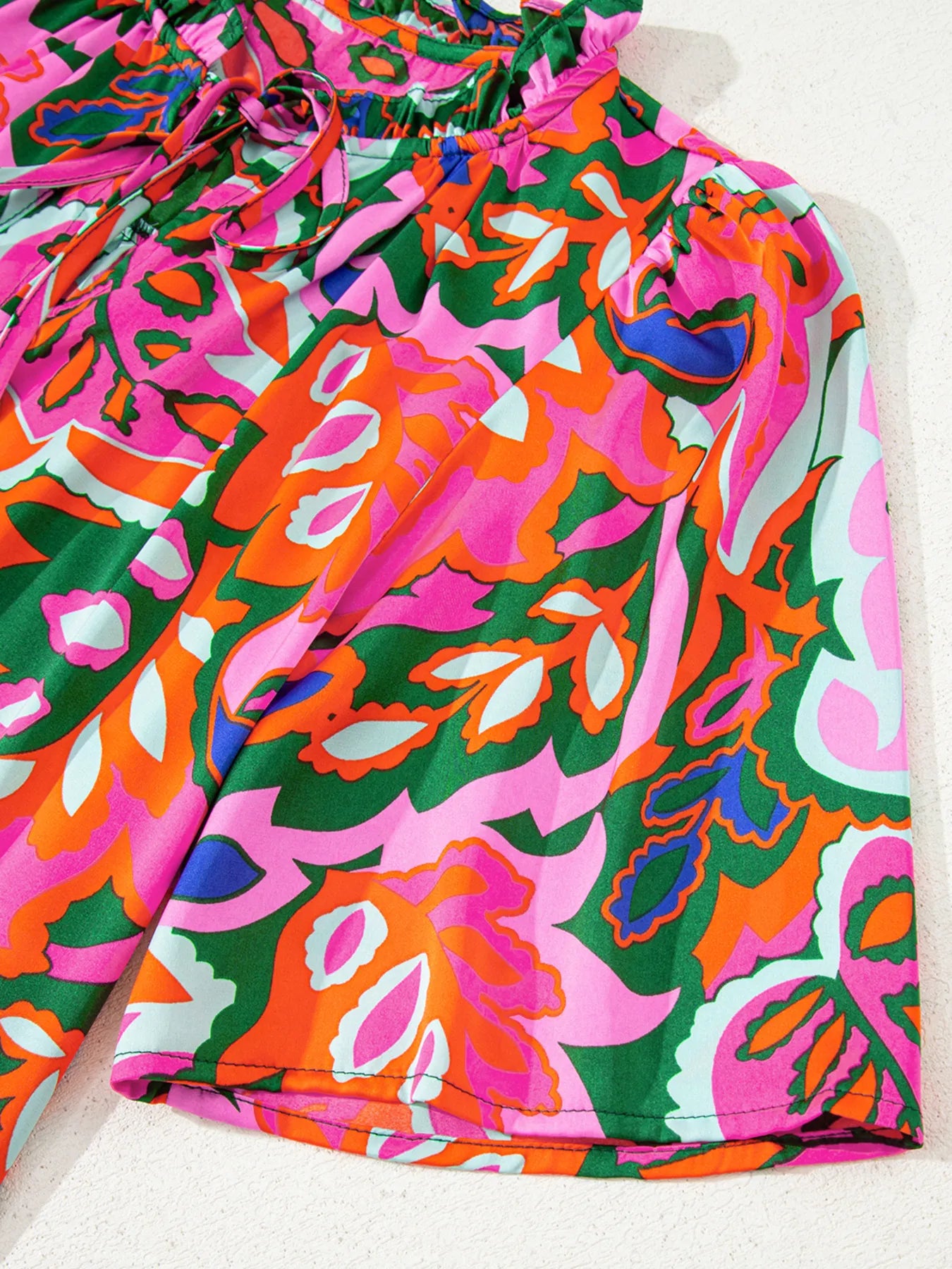 Tropical Print Short Sleeve Tie Neck Blouse.