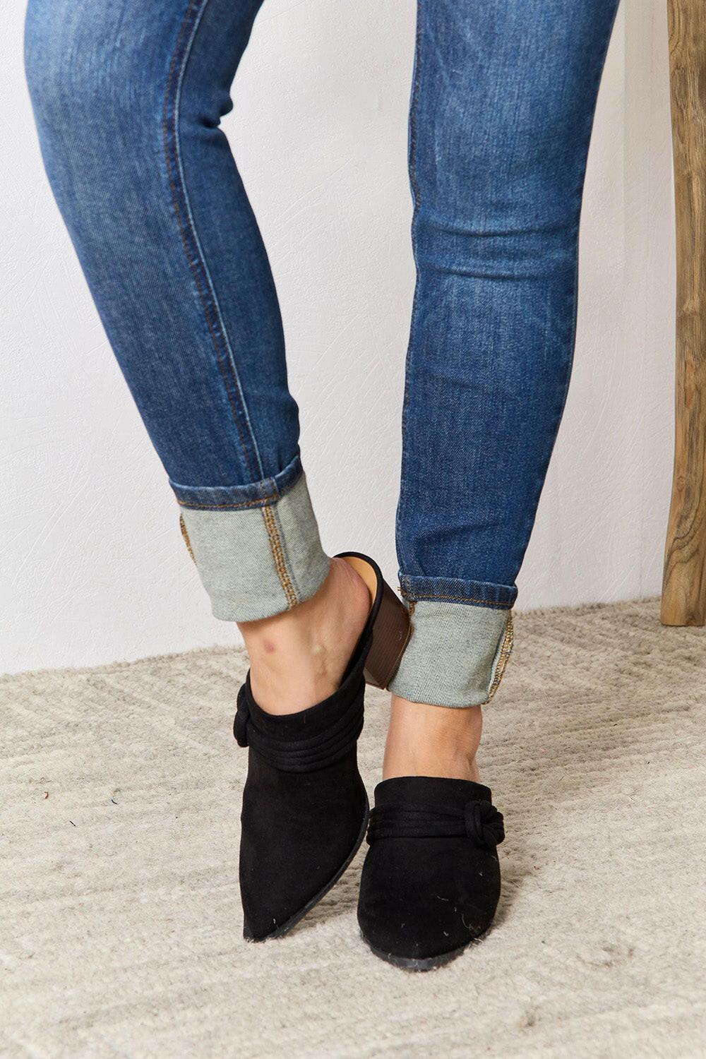 Pointed-Toe Braided Trim Mules.