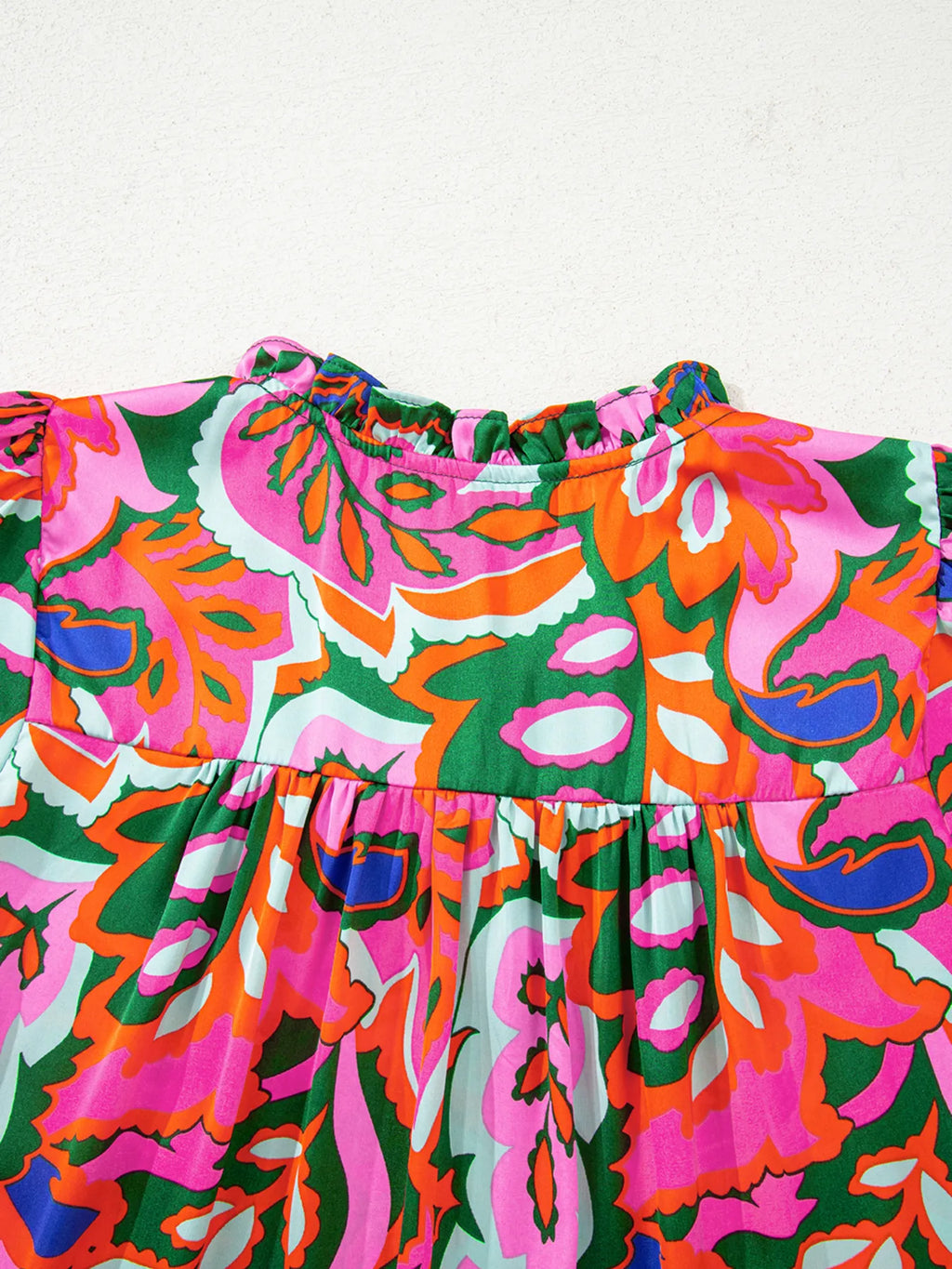 Tropical Print Short Sleeve Tie Neck Blouse.
