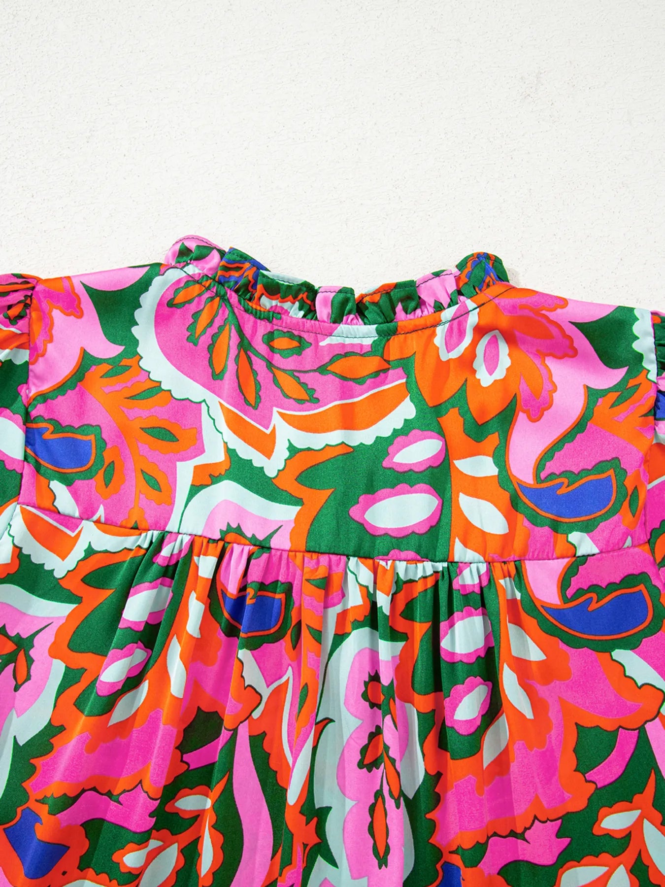 Tropical Print Short Sleeve Tie Neck Blouse.