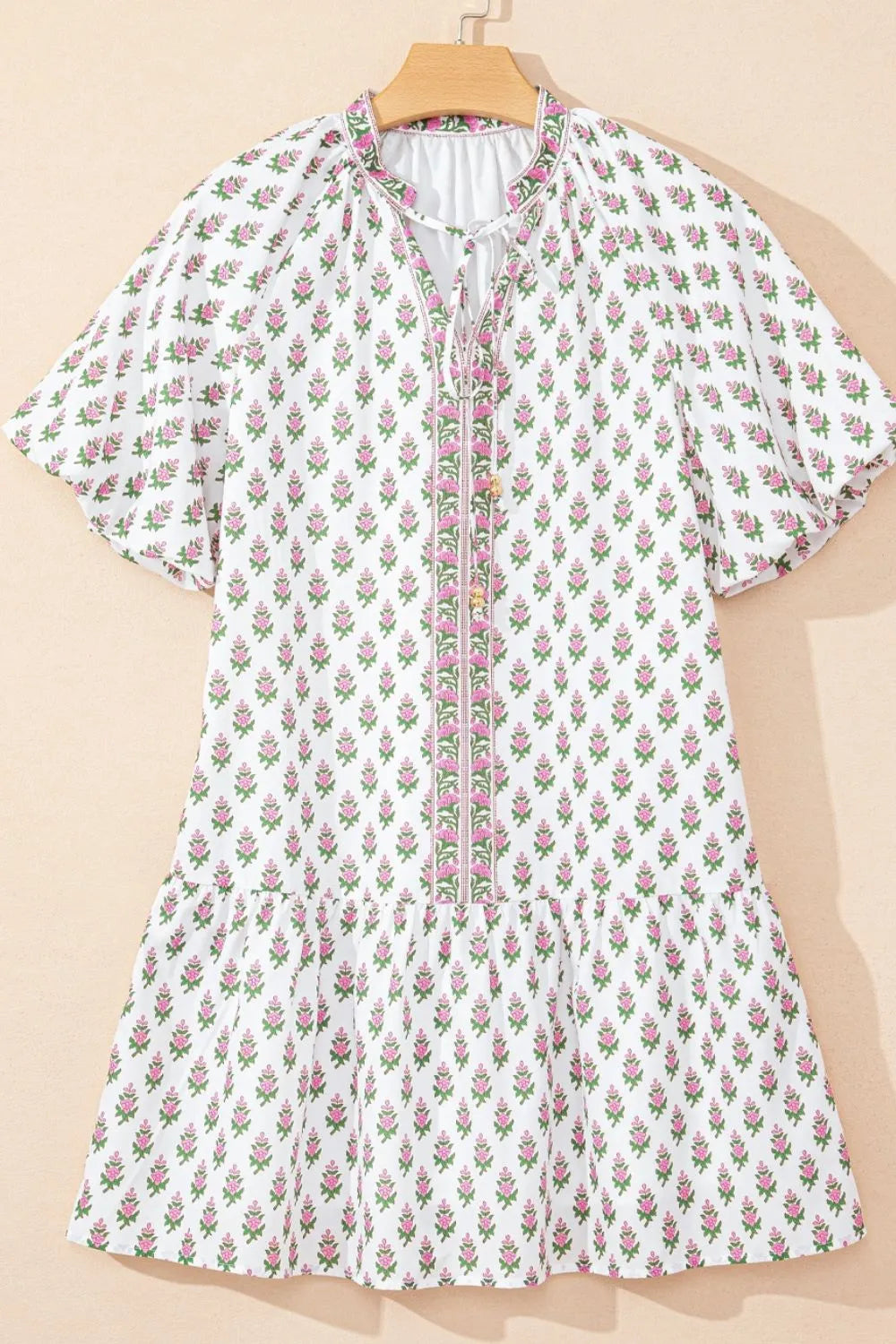 Puff Sleeve Tie Neck Ruffled Hem Dress.