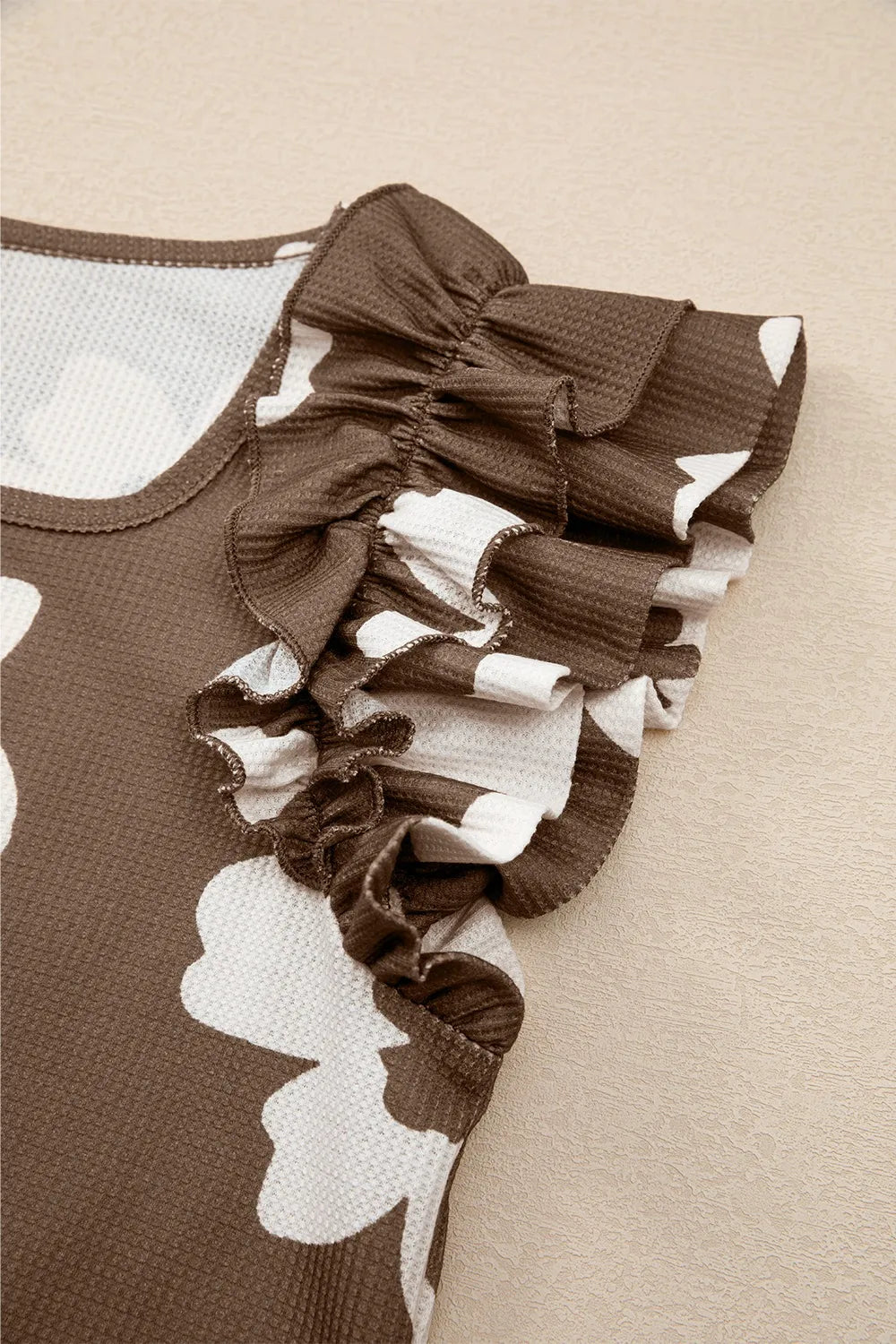 Floral Textured Ruffled Cap Sleeve Blouse.