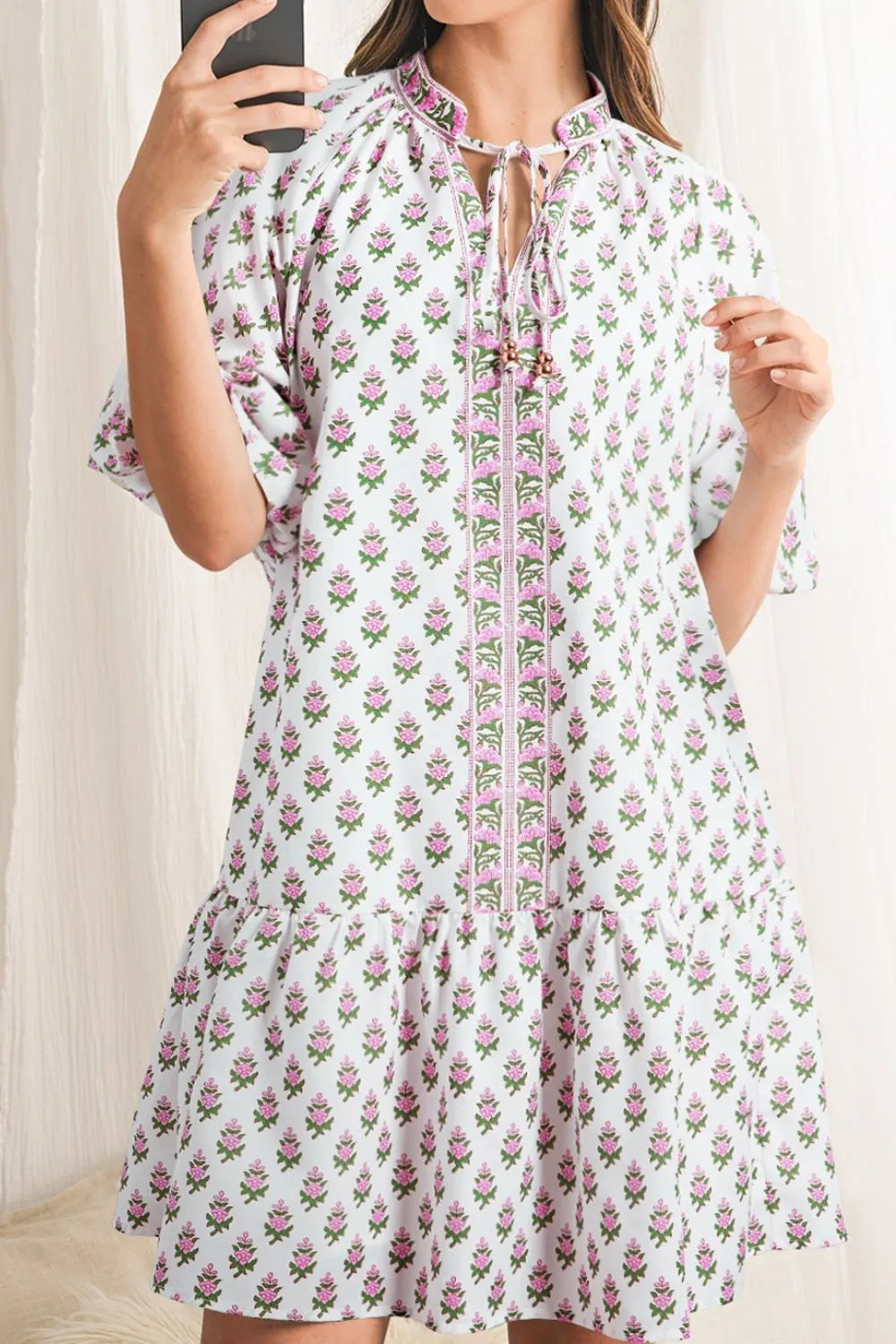 Puff Sleeve Tie Neck Ruffled Hem Dress.