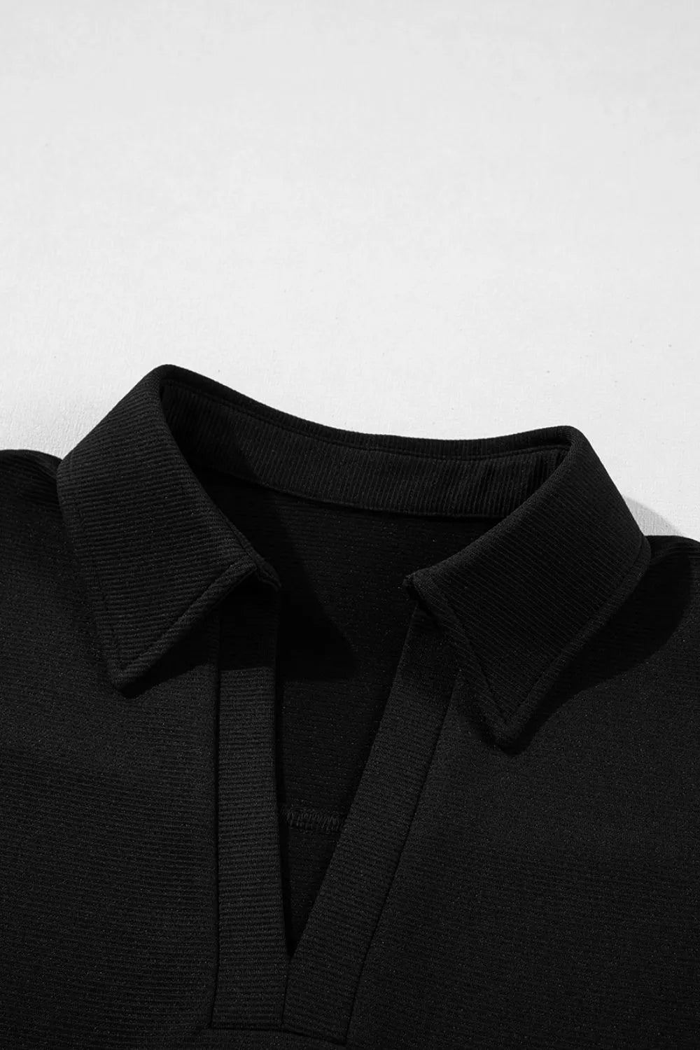 Notched Sleeveless Mini Dress.