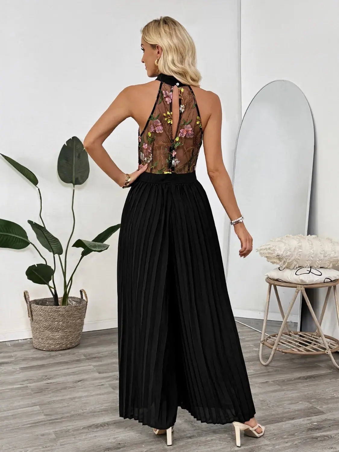 Floral Embroidered Halter Neck Pleated Jumpsuit.