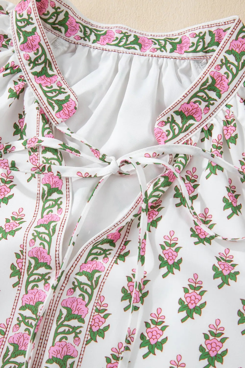 Puff Sleeve Tie Neck Ruffled Hem Dress.