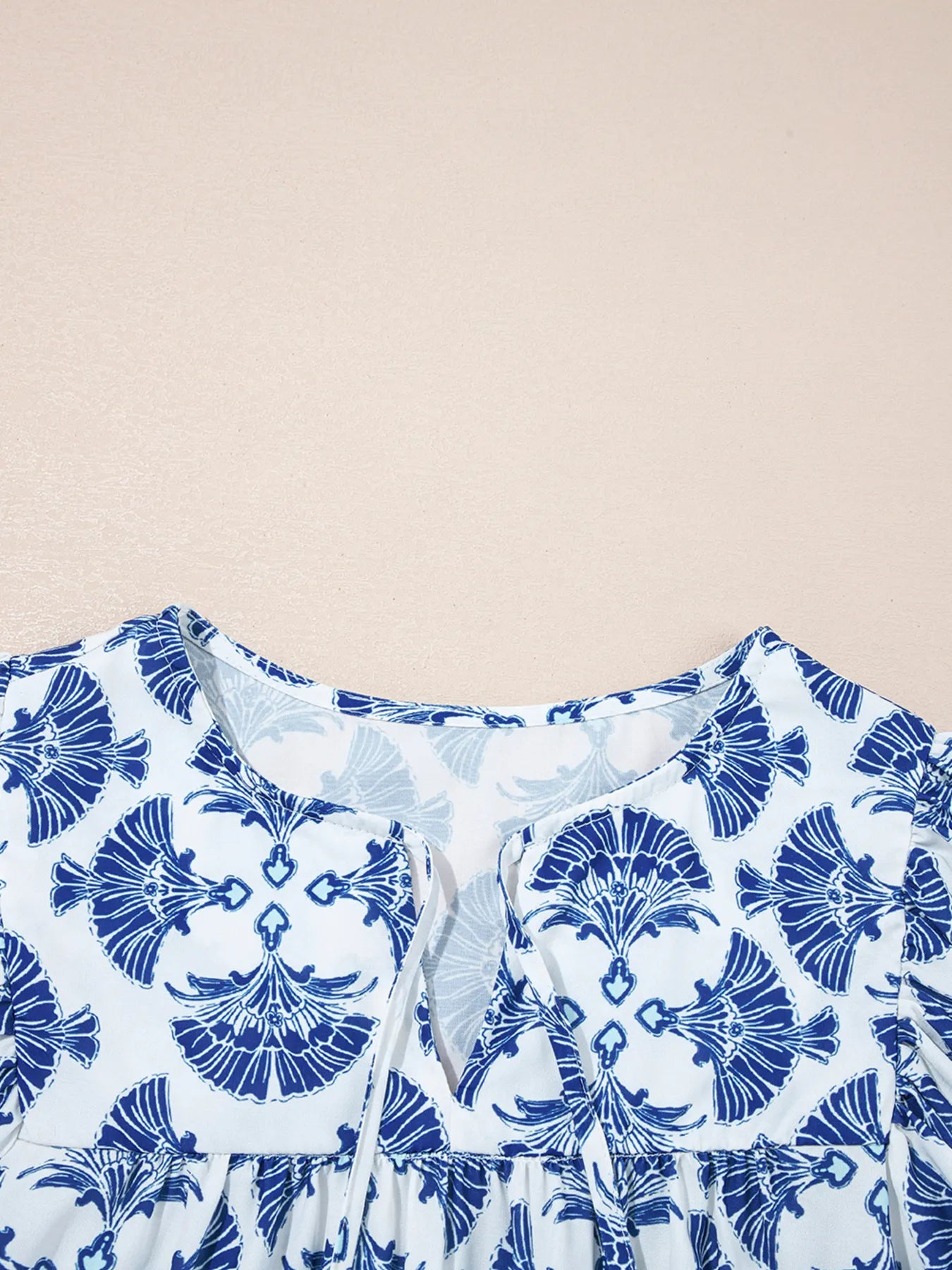 Printed Tassel Tie Neck Blouse.