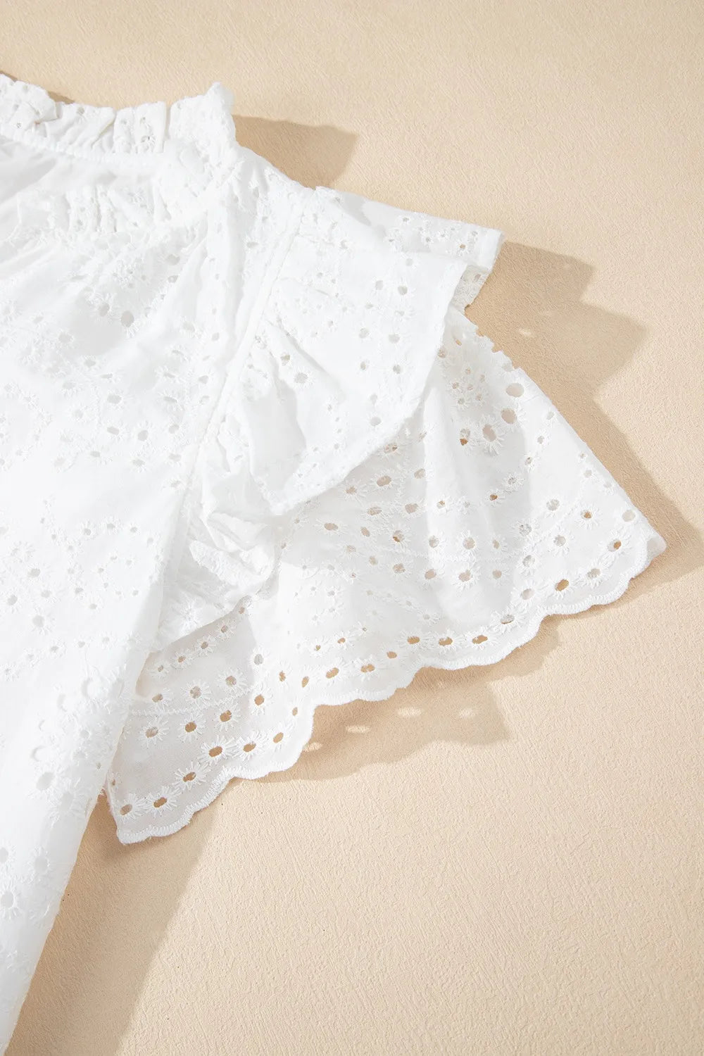 Eyelet Notched Short Sleeve Blouse.