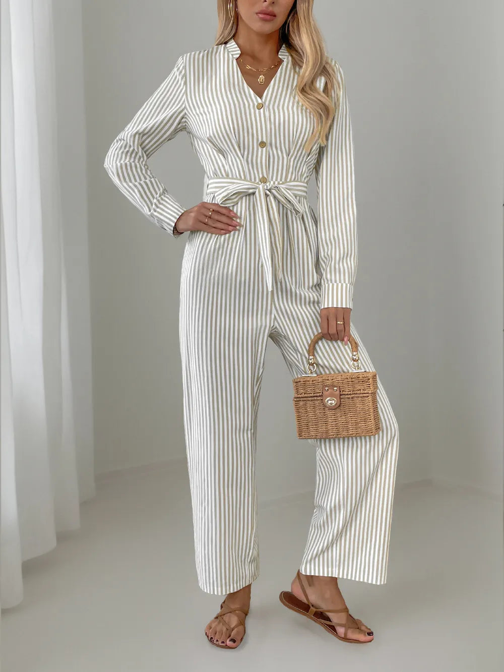Striped Notched Long Sleeve Tie Waist Jumpsuit.