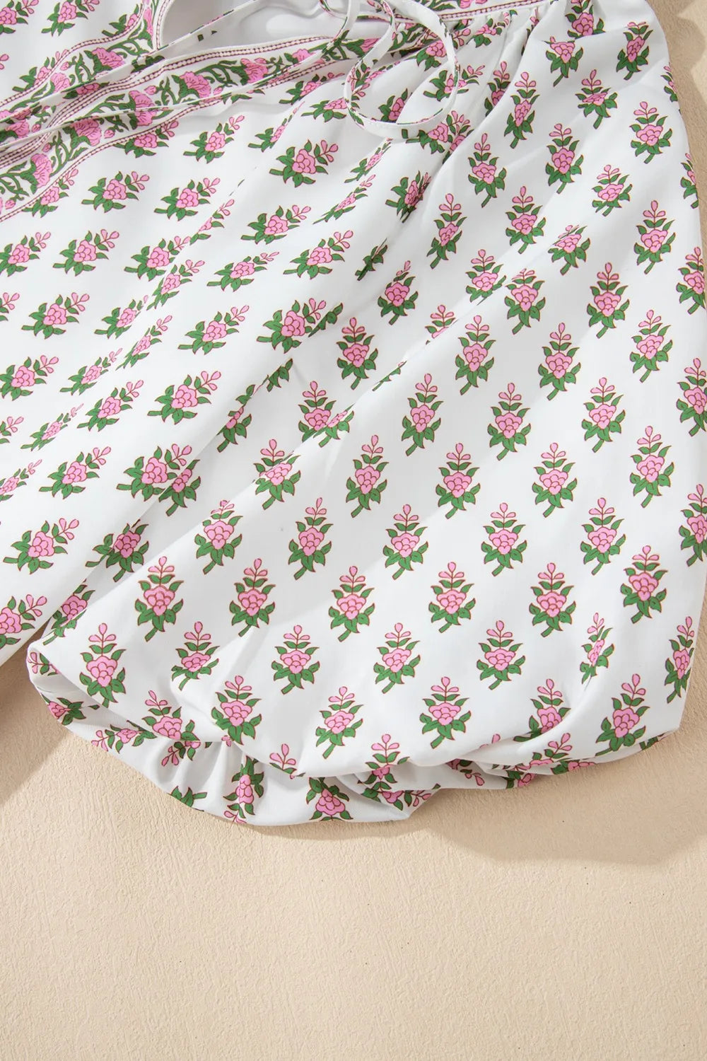 Puff Sleeve Tie Neck Ruffled Hem Dress.