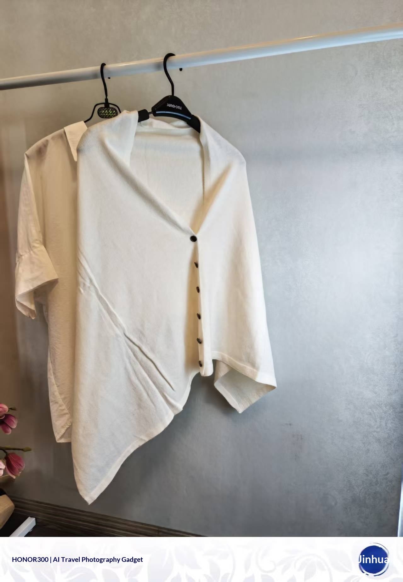 Off-white slouchy knit women's shawl with button-front detail, versatile autumn warmth in a sophisticated blend fabric style.