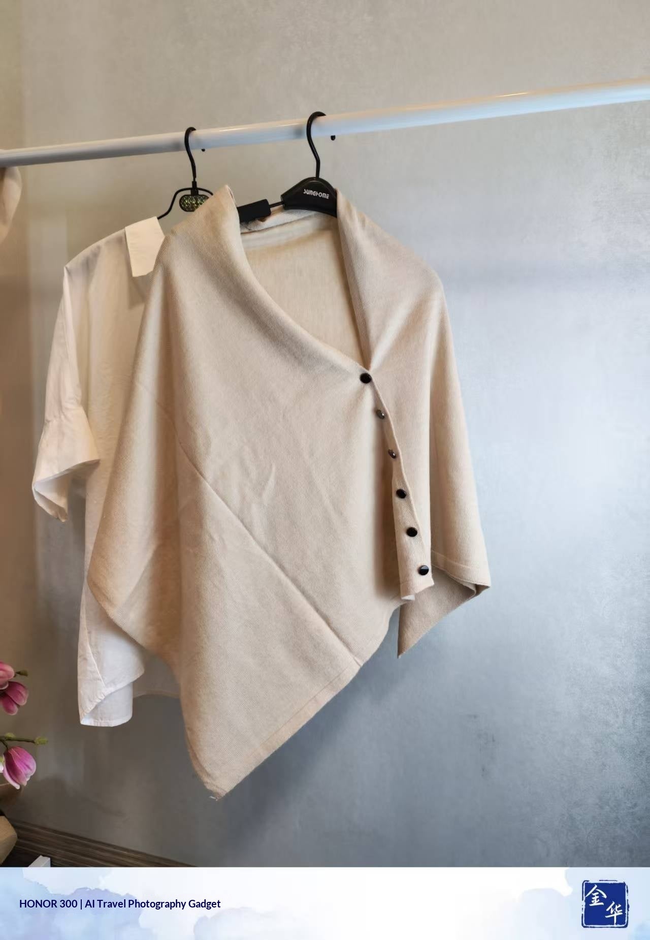 Off-white slouchy knit shawl for women with side button detail, offering warm vintage style for autumn.