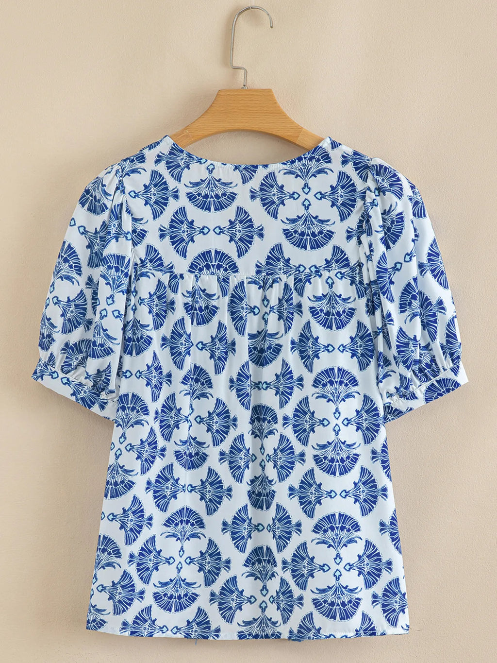 Printed Tassel Tie Neck Blouse.