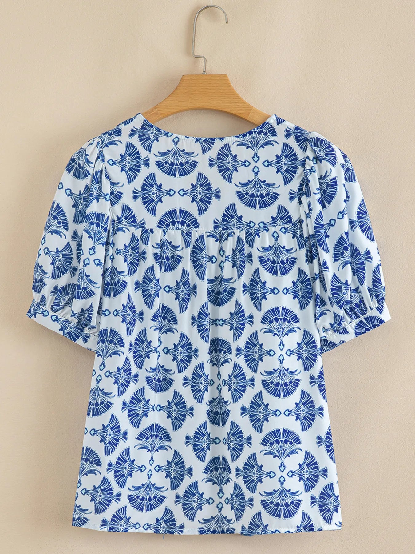 Printed Tassel Tie Neck Blouse.