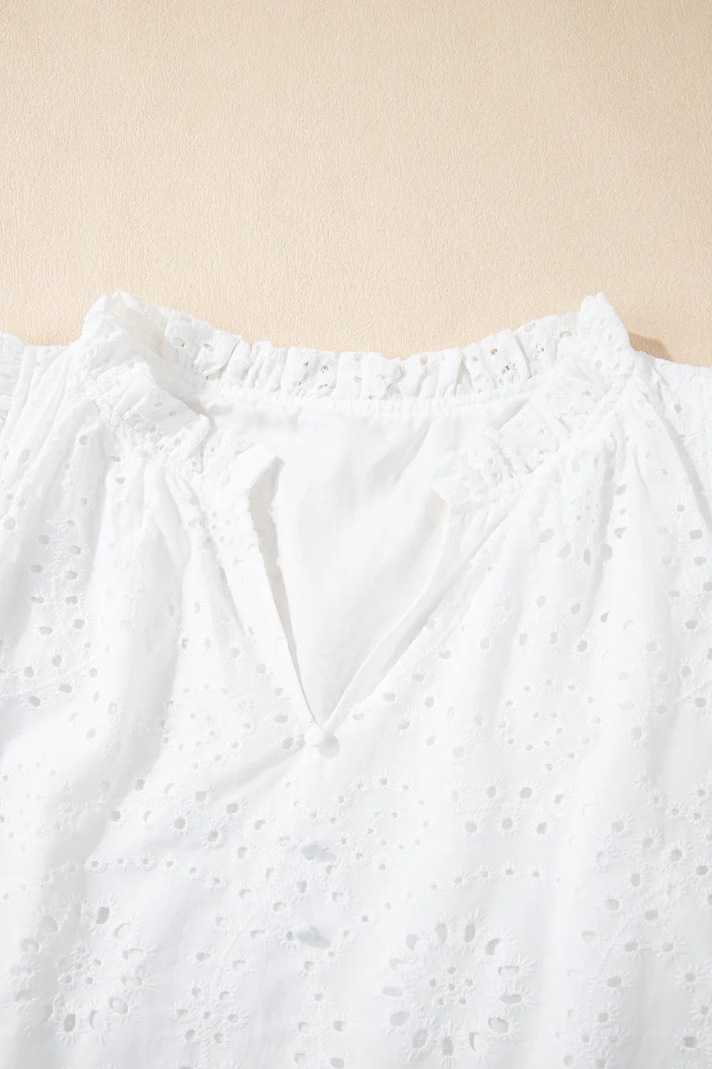 Eyelet Notched Short Sleeve Blouse.