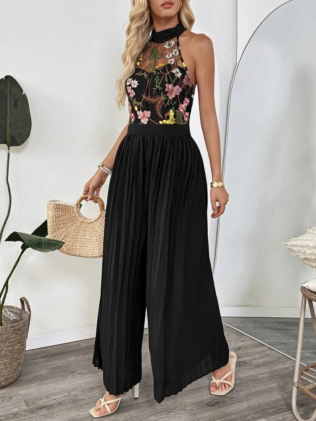 Floral Embroidered Halter Neck Pleated Jumpsuit.