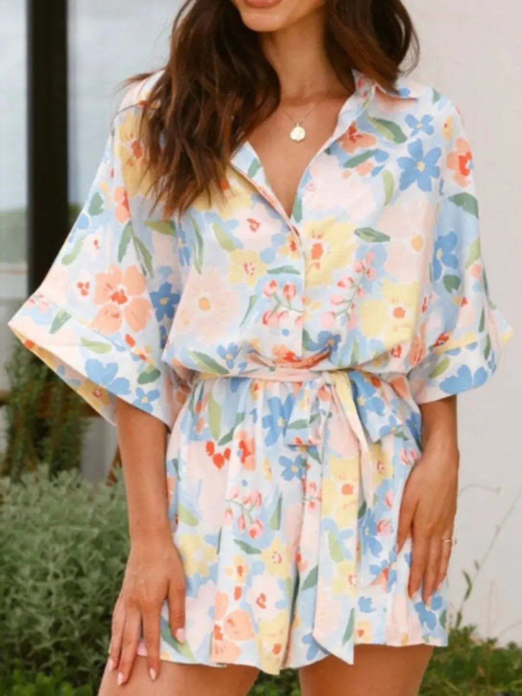 Printed Half Sleeve Tie Waist Romper.