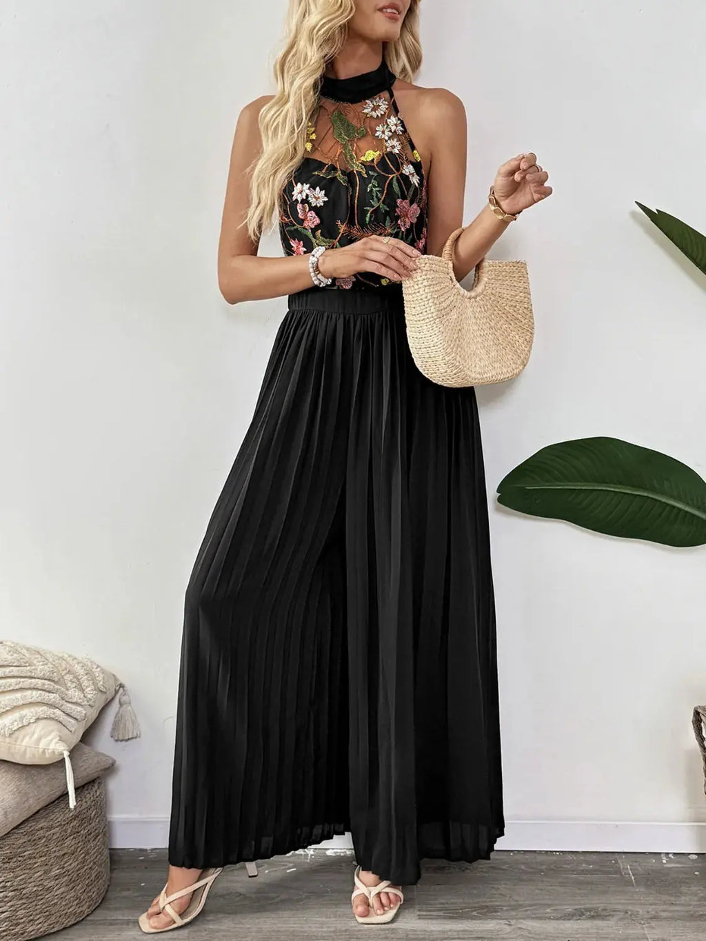 Floral Embroidered Halter Neck Pleated Jumpsuit.