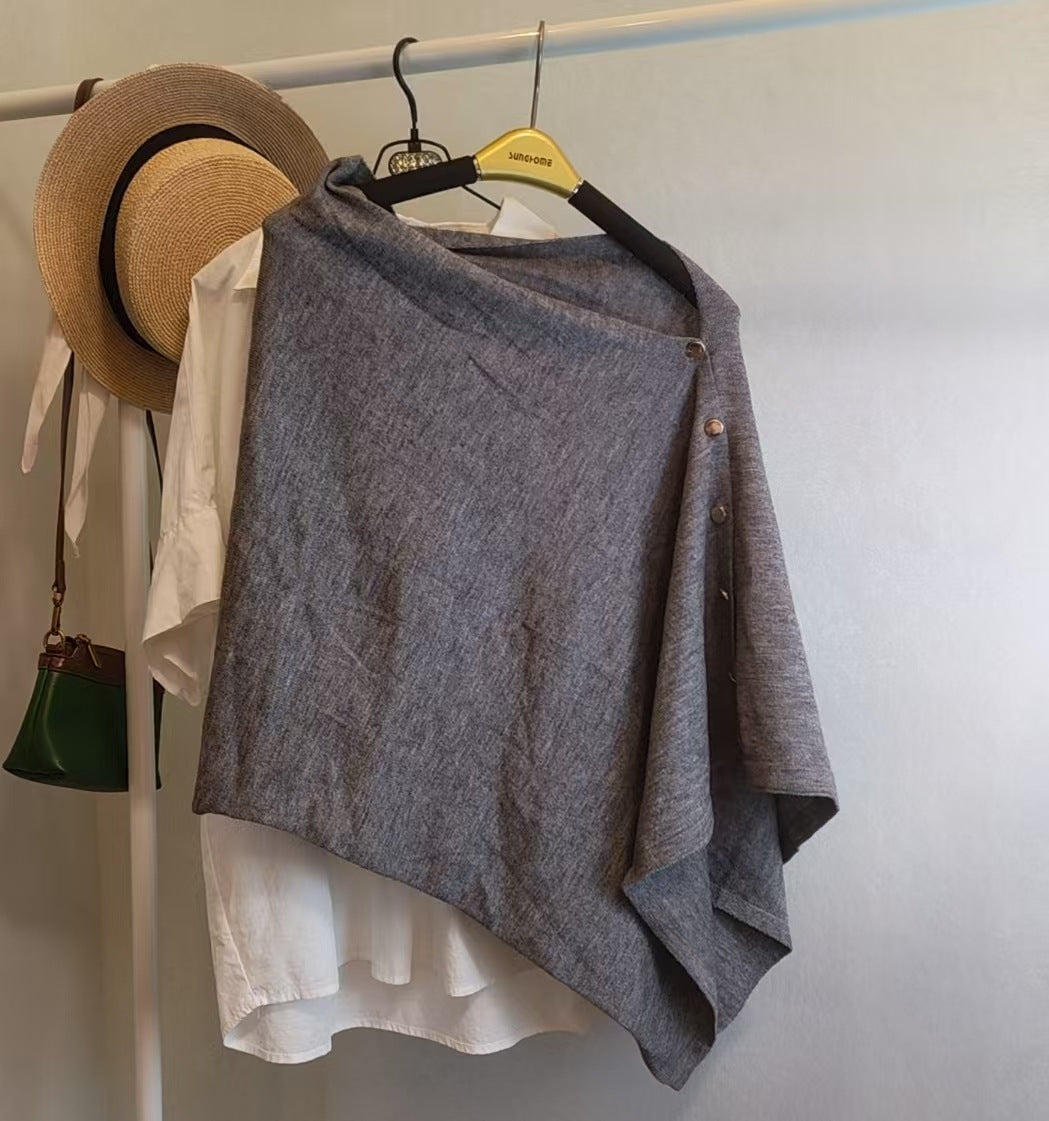 Slate gray slouchy knit shawl with side buttons for women, offering warm autumn style and sophisticated versatility.