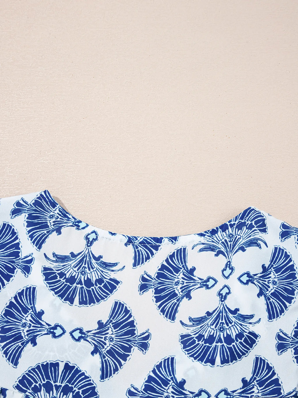 Printed Tassel Tie Neck Blouse.