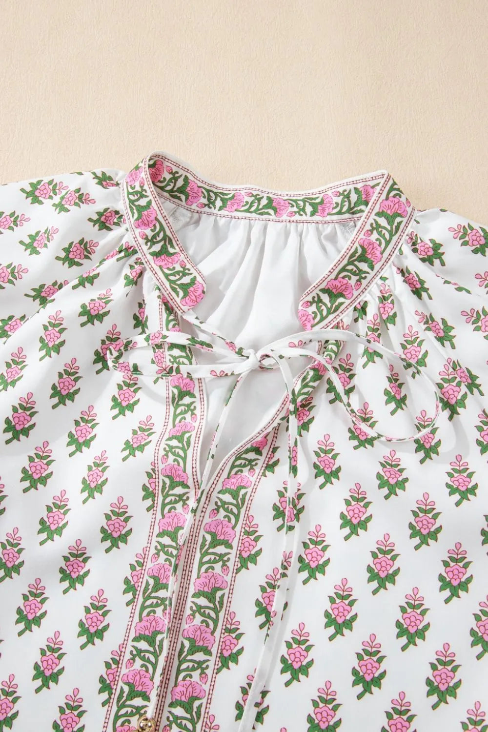 Puff Sleeve Tie Neck Ruffled Hem Dress.