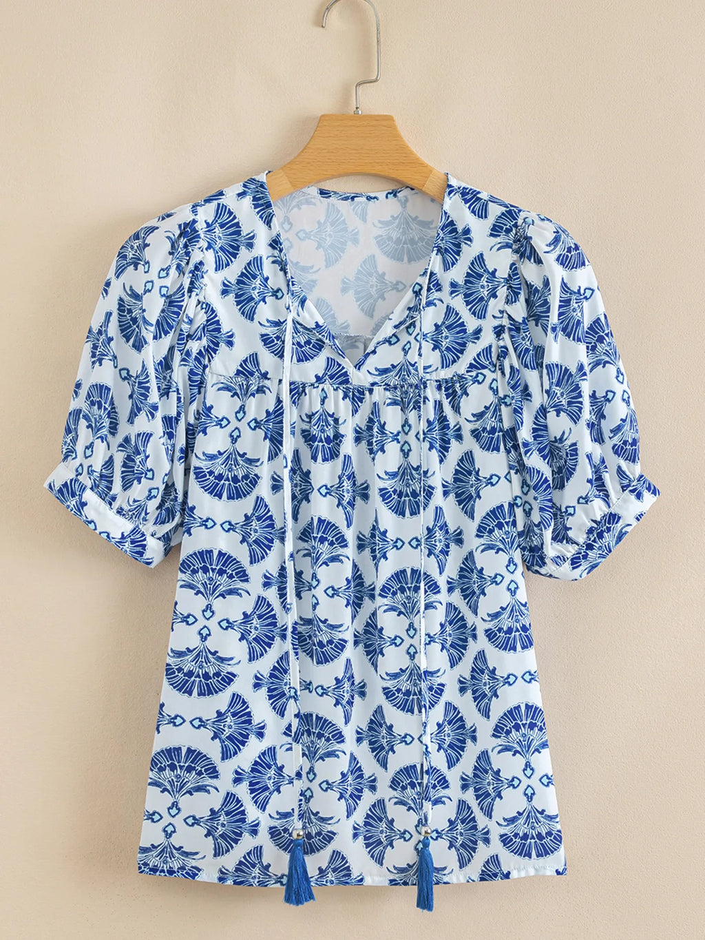 Printed Tassel Tie Neck Blouse.