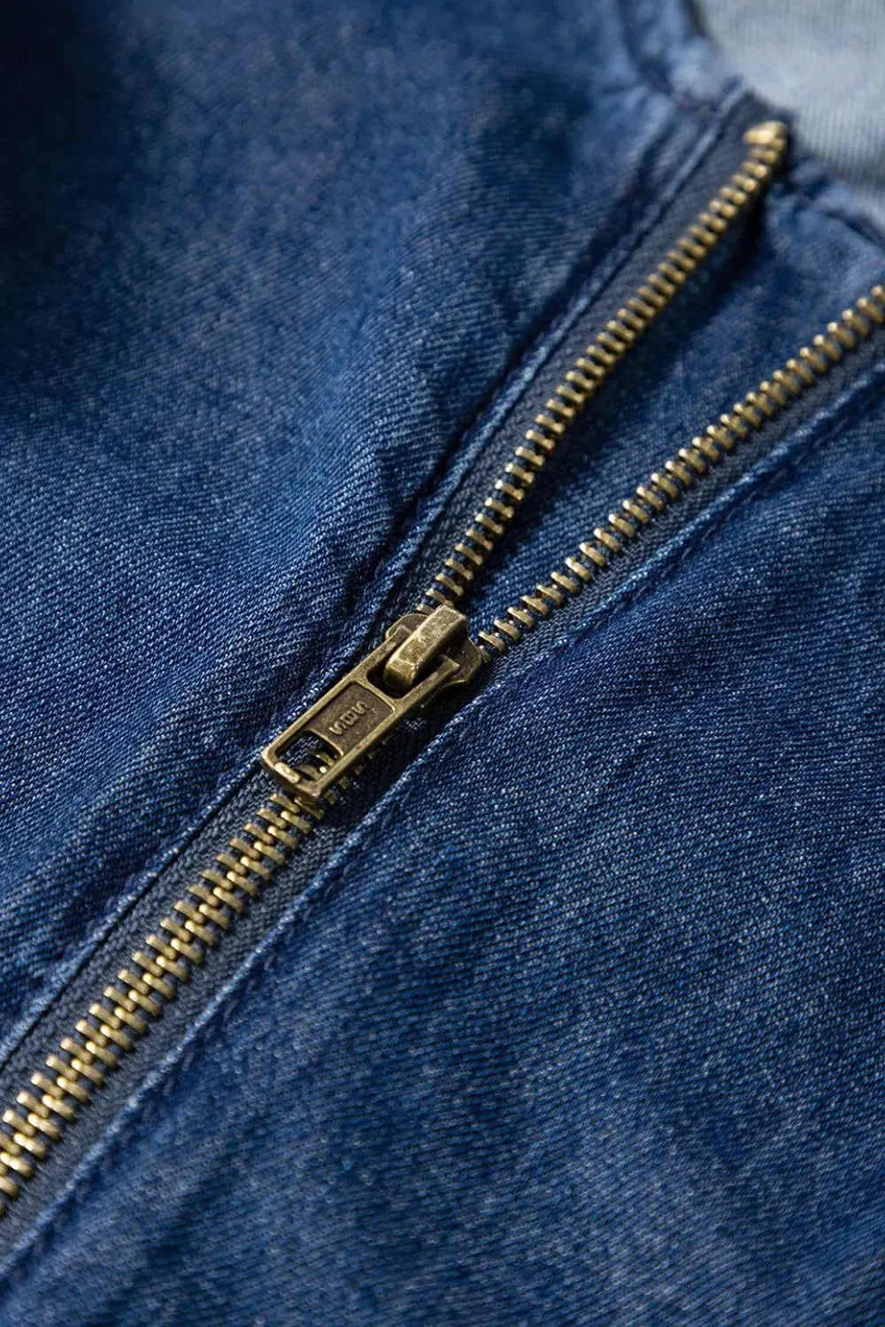 Denim Ruffled Zipped Front Belted Romper.