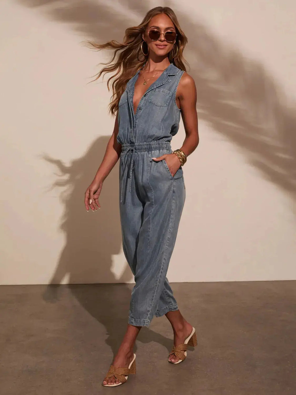 Sleeveless Drawstring Waist Washed Denim Jumpsuit.