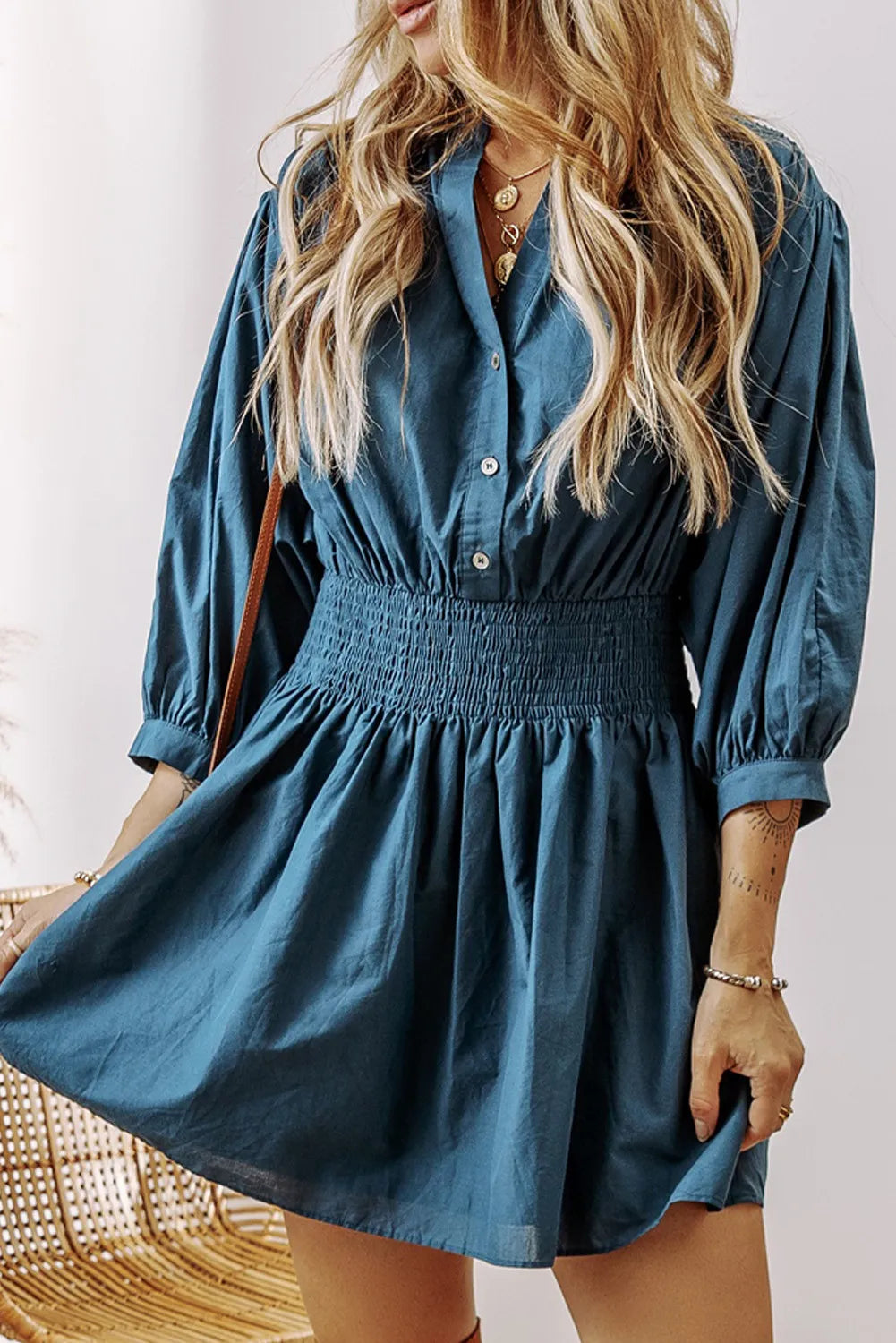 Smocked Half Button Three-Quarter Sleeve Mini Dress.