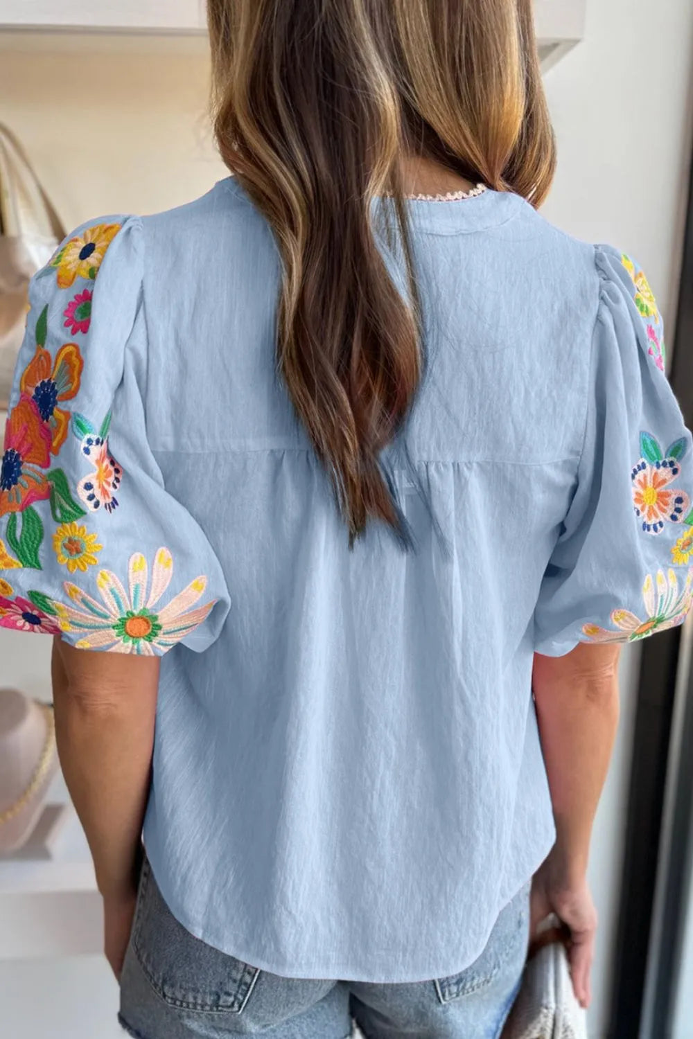 Embroidered Tie Neck Short Sleeve Blouse.