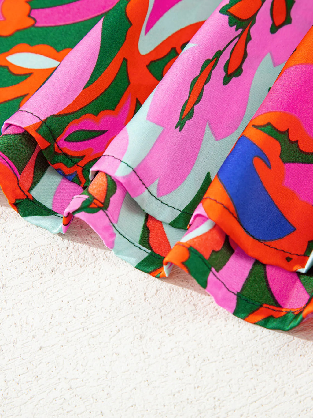 Tropical Print Short Sleeve Tie Neck Blouse.