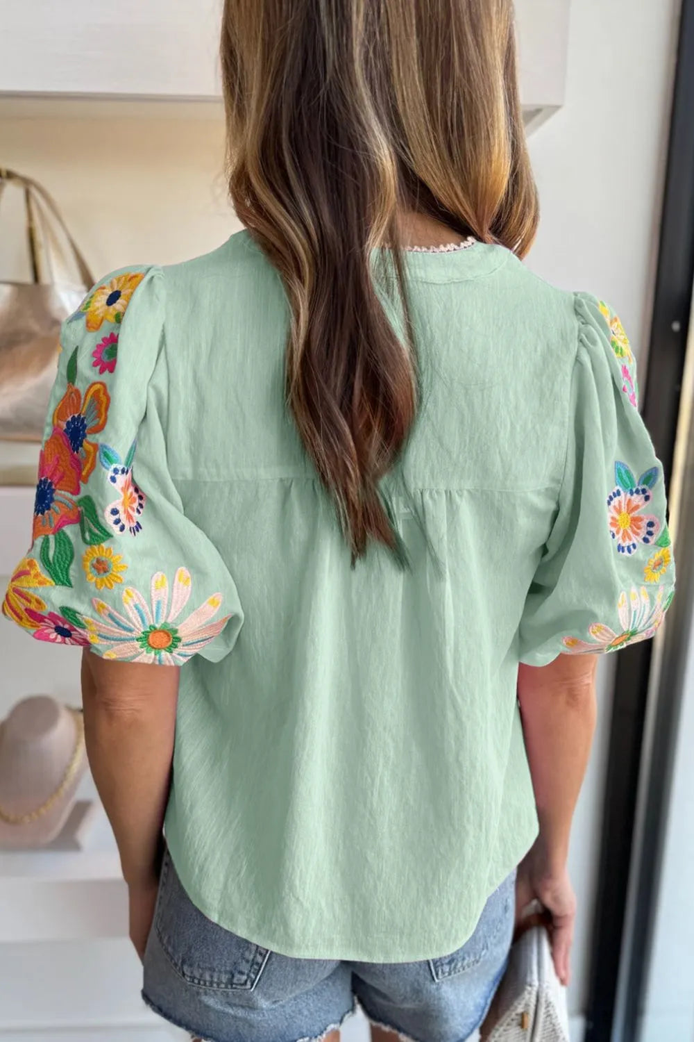 Embroidered Tie Neck Short Sleeve Blouse.