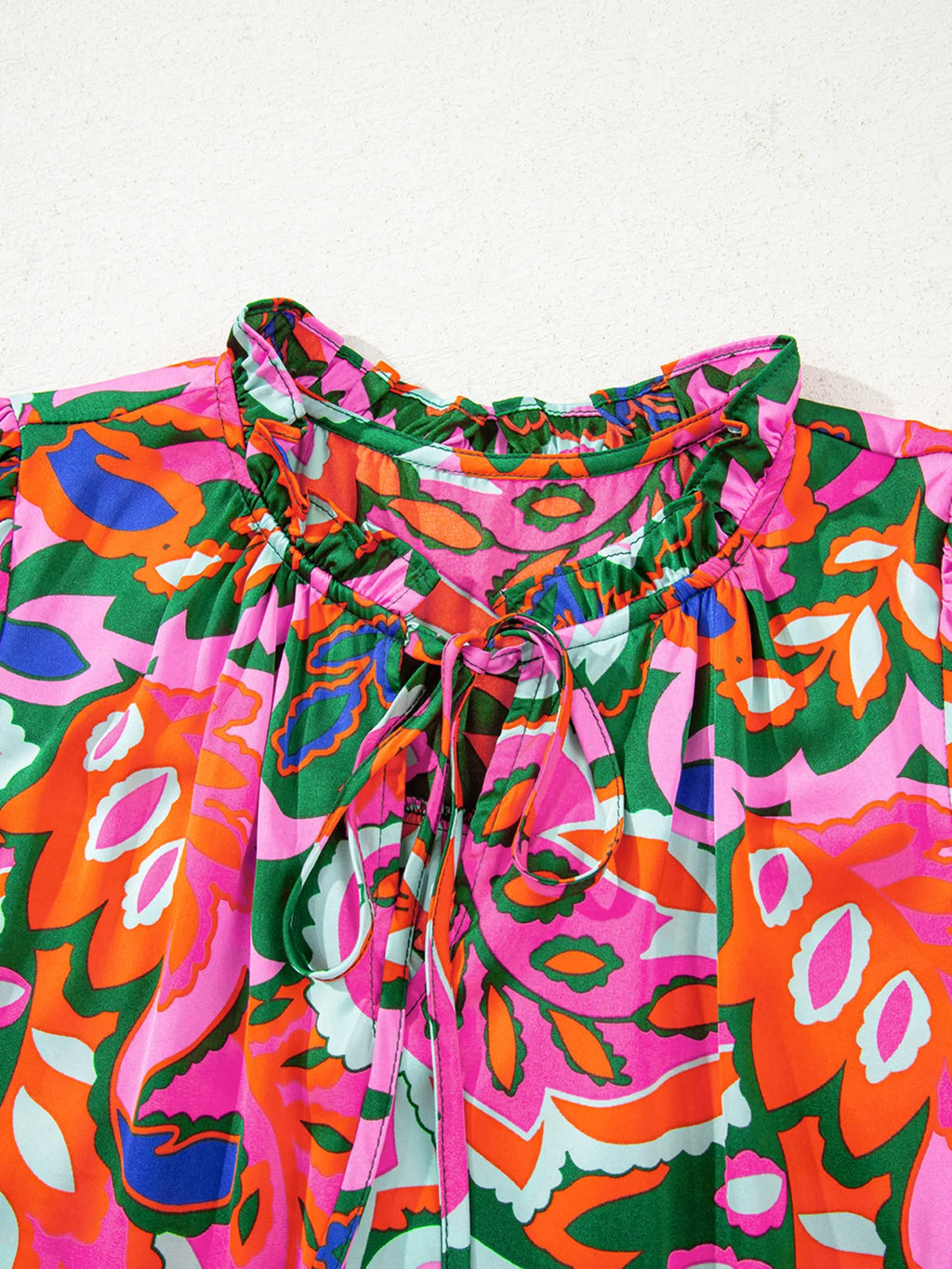 Tropical Print Short Sleeve Tie Neck Blouse.