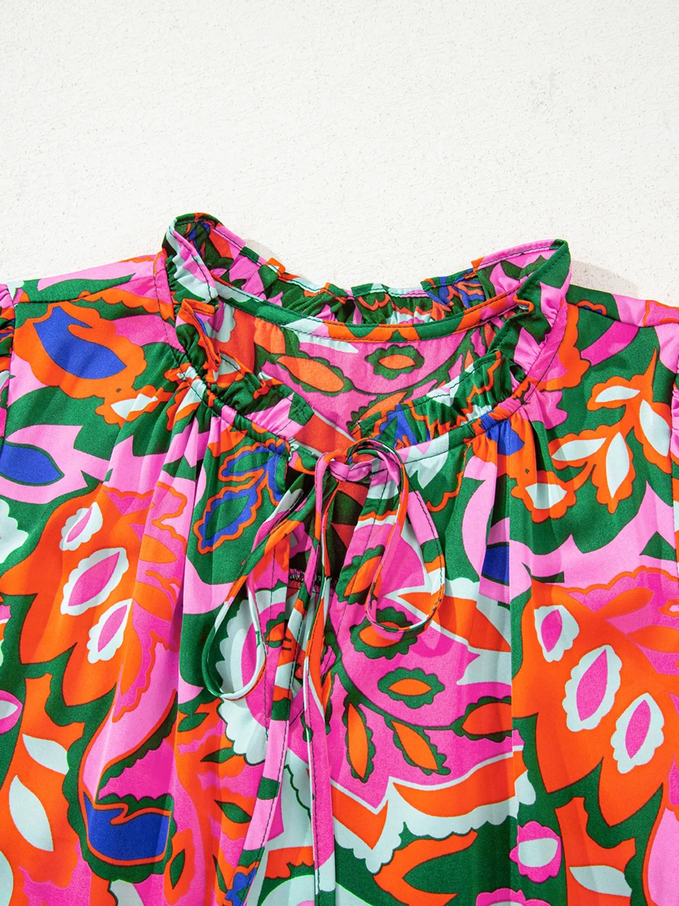 Tropical Print Short Sleeve Tie Neck Blouse.