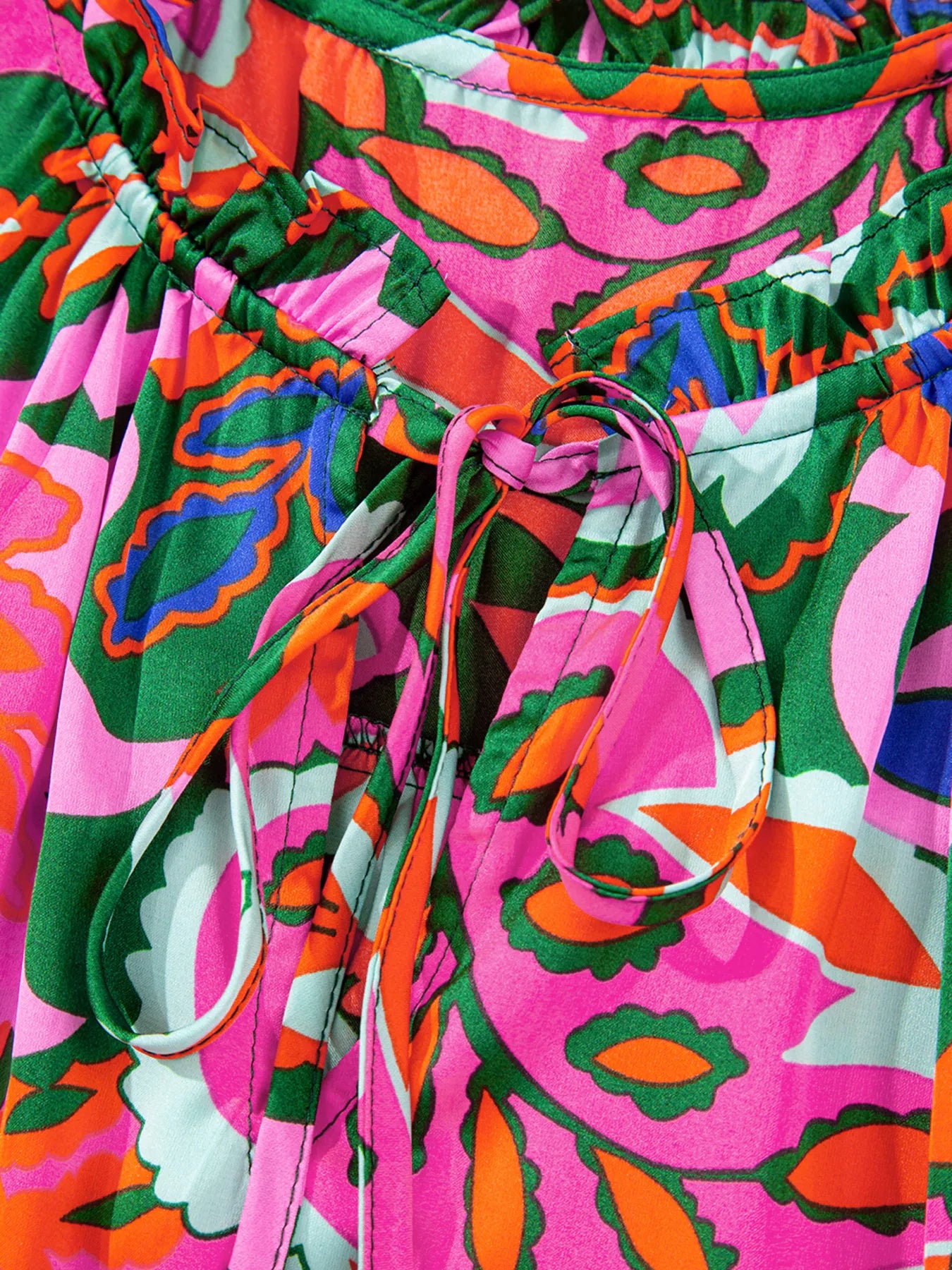 Tropical Print Short Sleeve Tie Neck Blouse.