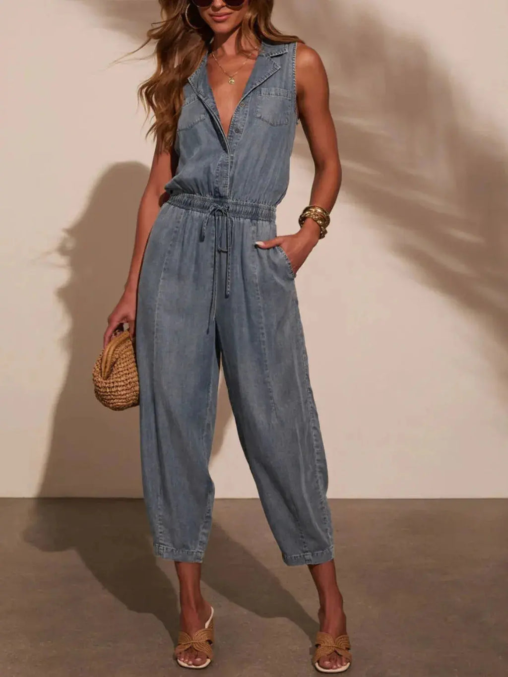 Sleeveless Drawstring Waist Washed Denim Jumpsuit.