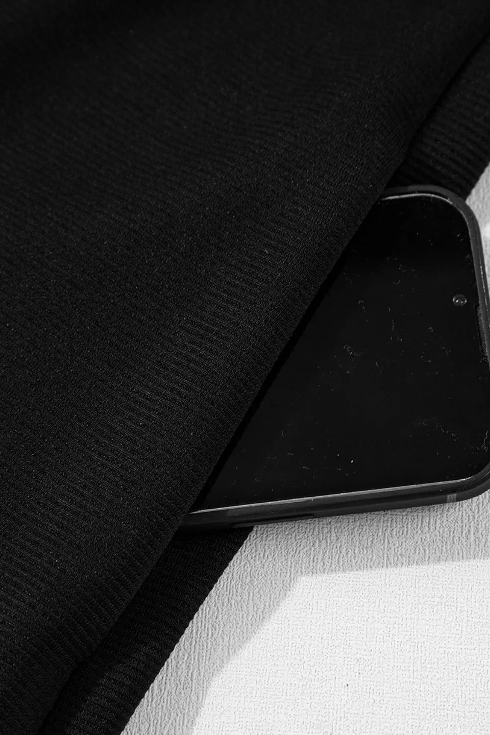 Notched Sleeveless Mini Dress.